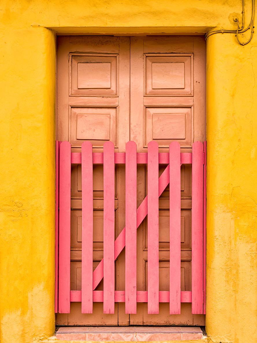 Travel, Electricity, Building Exterior, Textured, Rustic, Adobe, Cozumel, Caribbean Culture, Run-Down, Multi Colored, Yellow, Pink Color, Colors, Wood - Material, Old-fashioned, Old, Cultures, Architecture, Mexico, Caribbean, Weathered, Door, Wall - Building Feature, Gate, Built Structure, Cable, Picket